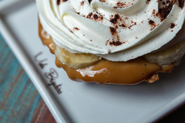 Close-Up Shot of a Dessert with Caramel Syrup and Icing