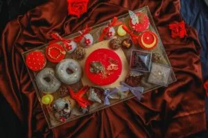 A luxurious dessert platter with chocolates, donuts, and more, ideal for festive celebrations.